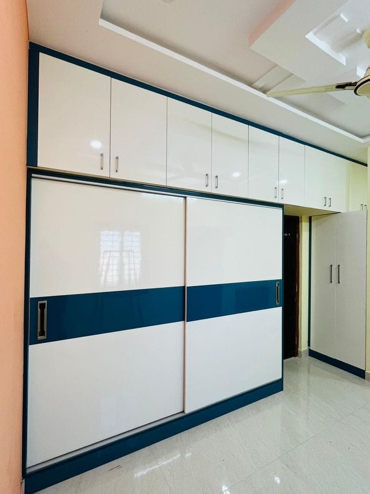 White and wood-finish modular kitchen cabinetry